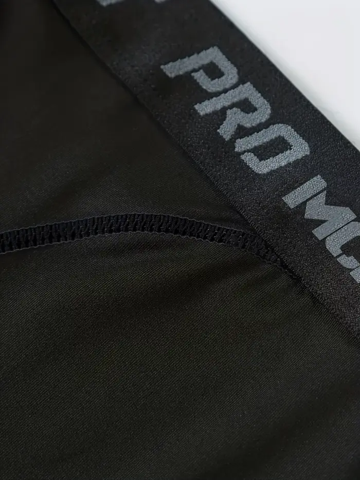 Pantalons serrés de sport de basket-ball