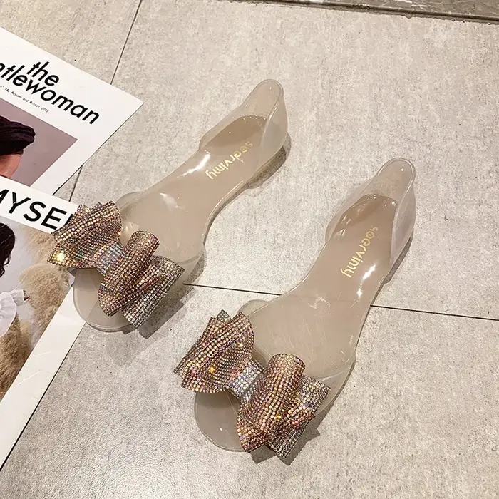 Sandales plates en plastique avec nœud en biscuits pour femme