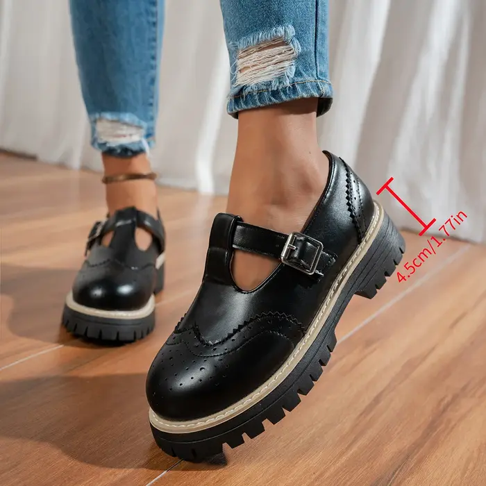 Chaussures plates noires à bride en T pour femmes