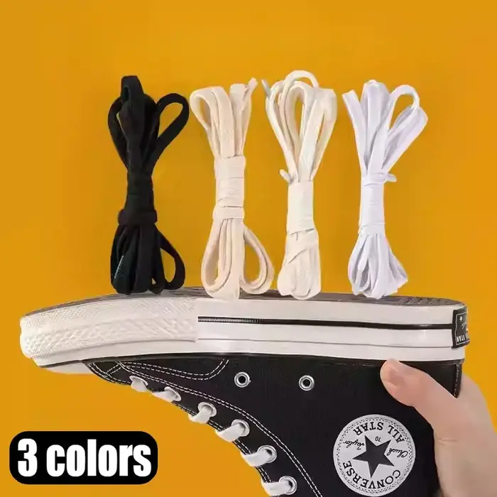 1 paire de lacets de chaussures noirs et blancs