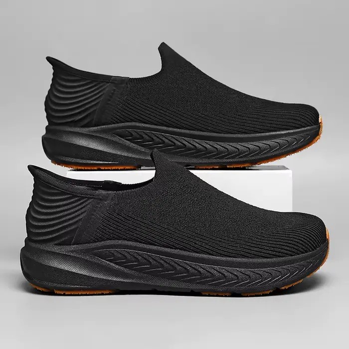 Chaussures de course noires en tricot pour hommes