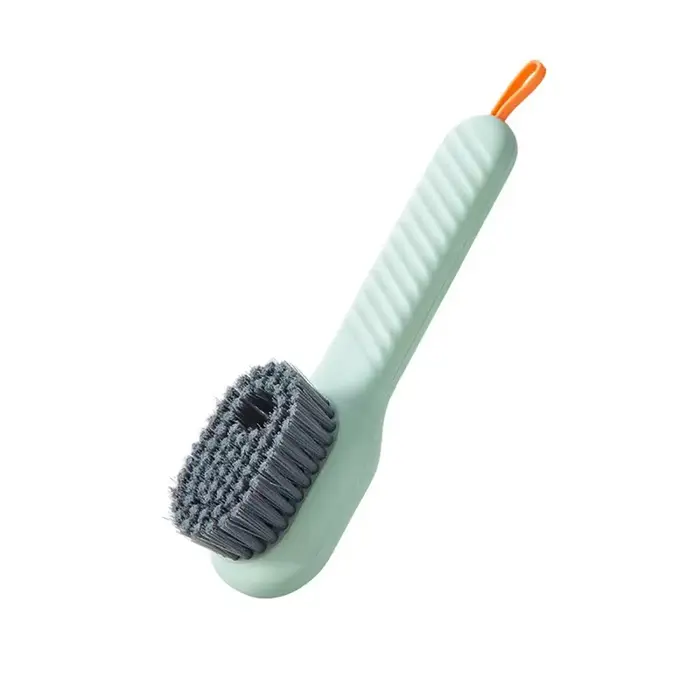 Brosse à chaussures à décharge automatique de liquide